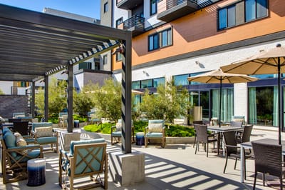 Outdoor patio area with seating and landscaping