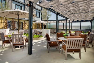 Outdoor seating area with umbrellas and planters