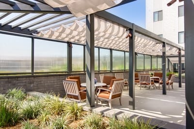 Outdoor patio area with seating and plants