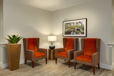 Cozy seating area with armchairs and artwork