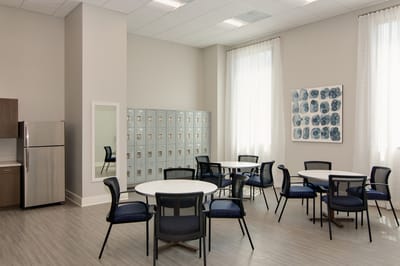 Bright common area with tables and chairs