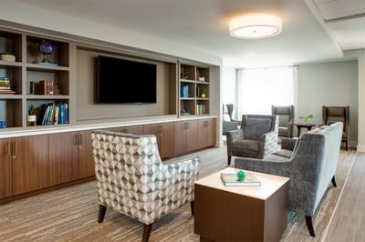 Cozy lounge area with comfortable seating and bookshelves
