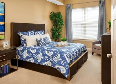 Stylish bedroom interior with a blue-themed decor
