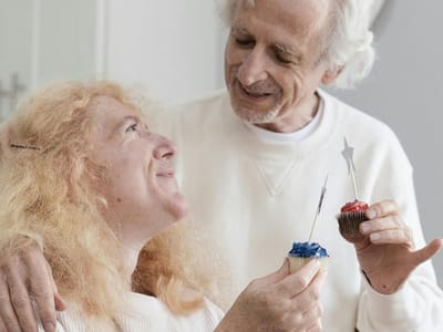 Residents celebrating with cupcakes and candles
