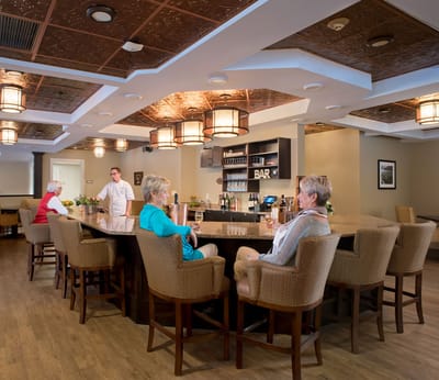 Residents enjoying drinks at the bar area