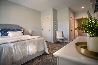 Cozy resident bedroom with soft lighting and decor