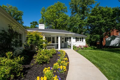 Exterior view of Vienna Manor Assisted Living with gardens