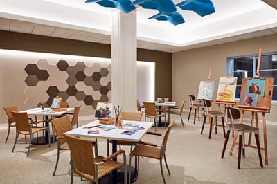 Art activity room with easels and art supplies