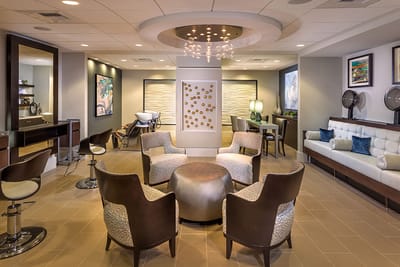 Modern common area with seating and decorative lighting