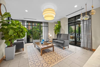 Stylish lobby area with seating and plants