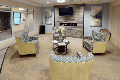 Comfortable common area with chairs and a fireplace
