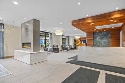 Bright lobby area with seating and reception desk