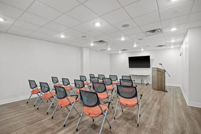 Bright activity room with chairs for residents