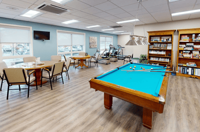 Interior lounge area with pool table and seating