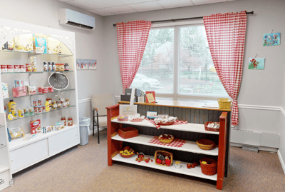 Bright interior room with a snack shelf and seating