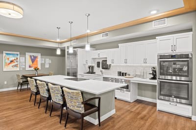 Bright kitchen space with modern appliances and seating.