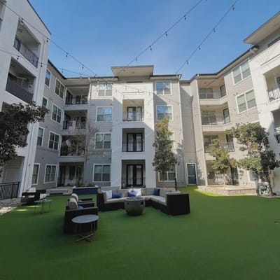 Outdoor courtyard with seating and decorative lighting
