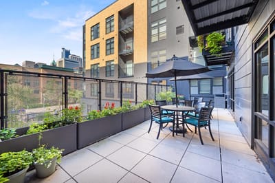 Outdoor terrace with seating and city view