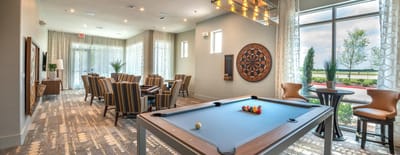 Interior activity room with billiards and seating