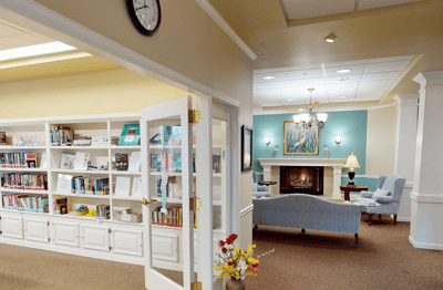 Cozy common area with bookshelves and seating
