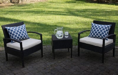 Outdoor seating area with chairs and a small table