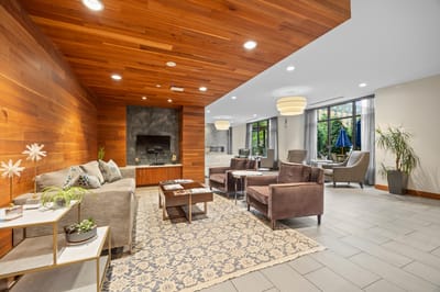Common area with comfortable seating and wood accents