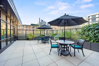 Outdoor terrace with seating and umbrellas
