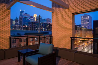 Balcony view of a city skyline at dusk
