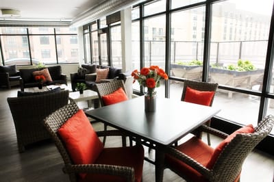 Cozy common area with seating and flower arrangement