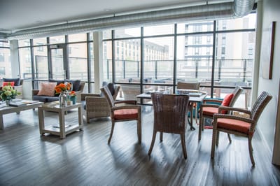 Bright common area with comfortable seating and large windows
