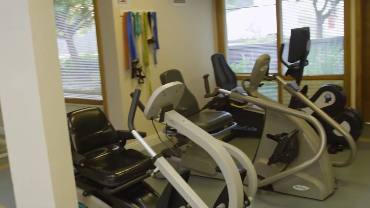 Fitness equipment in a therapy room at the facility