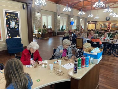 Residents engaged in a crafts activity.