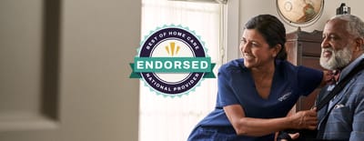 Family Home Care of Central Florida, home care in Winter Park, FL — Caregiver assisting an elderly man with a smile