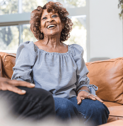Smiling resident enjoying time in a common area