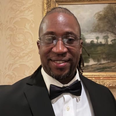 Man in formal attire with a bow tie