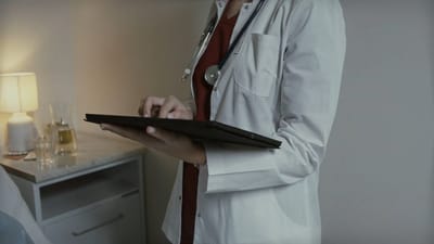 Healthcare professional using a tablet