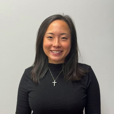 Smiling staff member posing for a photo.