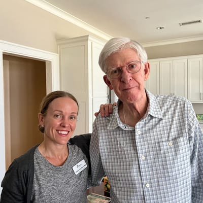 Staff member with a resident in an indoor setting
