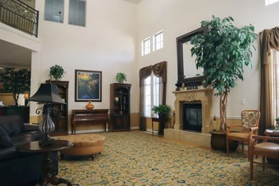 Interior view of a common area with seating and plants