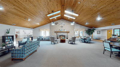 Interior common area with seating and a fireplace