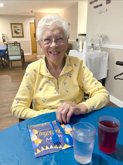 A resident celebrating a birthday in the common area
