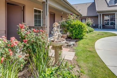 Flower garden with a fountain in the courtyard