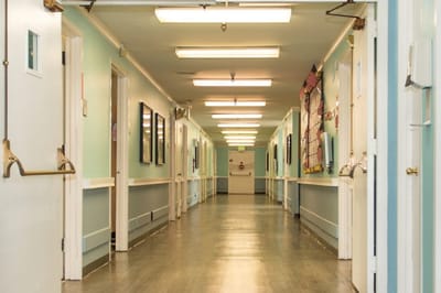 Well-lit interior hallway of a care center