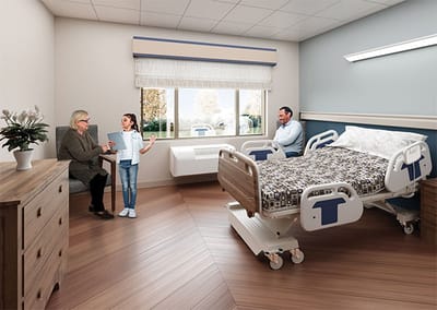 Interior view of a patient room with residents and a visitor
