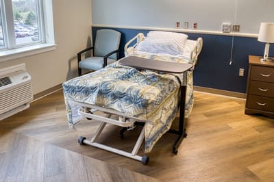A hospital-style bed in a resident's room