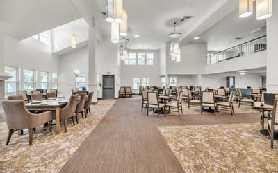 Bright dining room with chairs and tables arranged