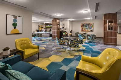 Bright common area with colorful seating and artwork