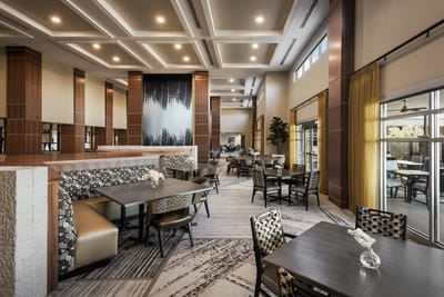 Bright dining area with modern decor and seating