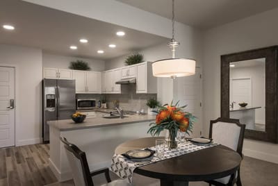 Modern kitchen interior with dining area and decor