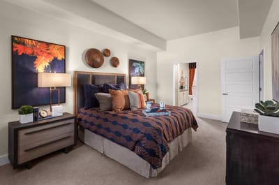 A well-decorated model bedroom in a senior living facility
